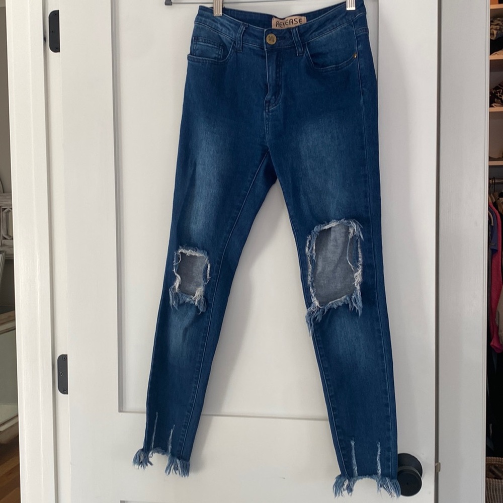 Ripped dark wash blue skinny jeans